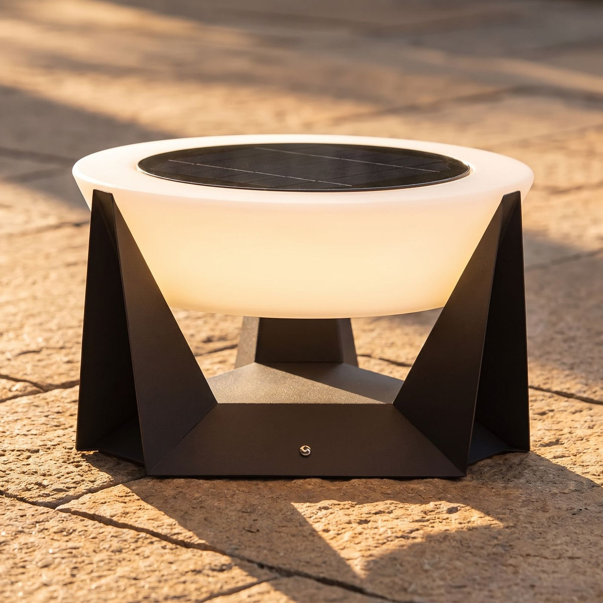 Solar Iron and Acrylic Outdoor Table Lamp, close view on stone pavers