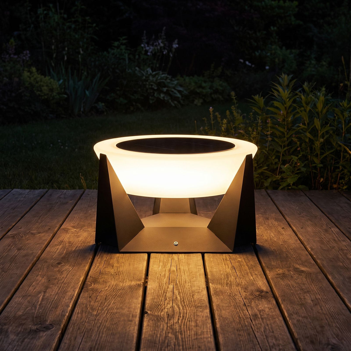 Solar Iron and Acrylic Outdoor Table Lamp glowing on a timber deck at night