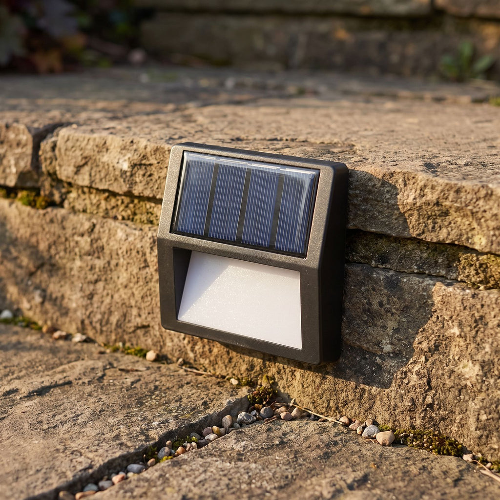 Solar LED Step and Deck Light, close view at 45 degrees on a stone wall