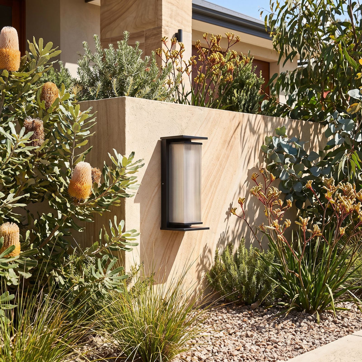 Solar Stainless Steel Box Outdoor Wall Light beside a timber front door