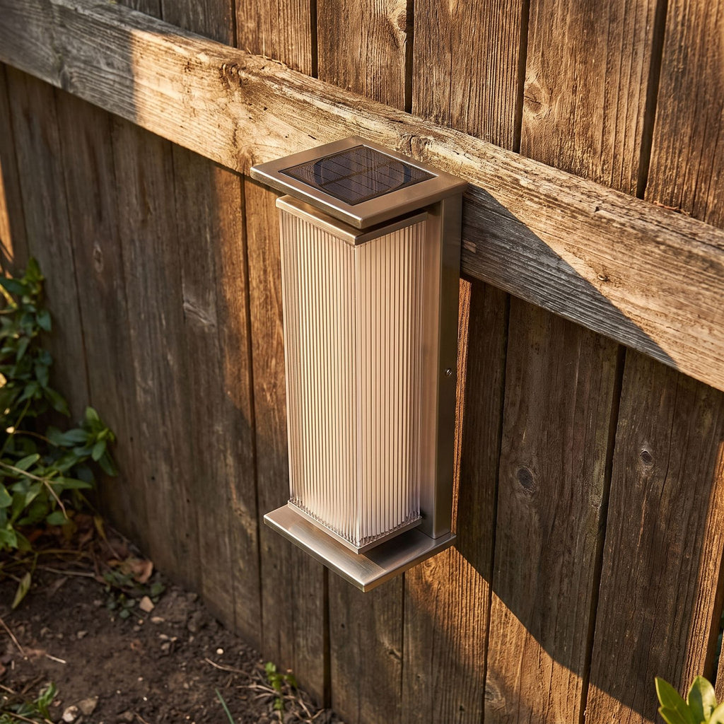Solar Stainless Steel Box Outdoor Wall Light, close view at 45 degrees on a stone wall