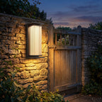Solar Stainless Steel Box Outdoor Wall Light on a porch wall at dusk