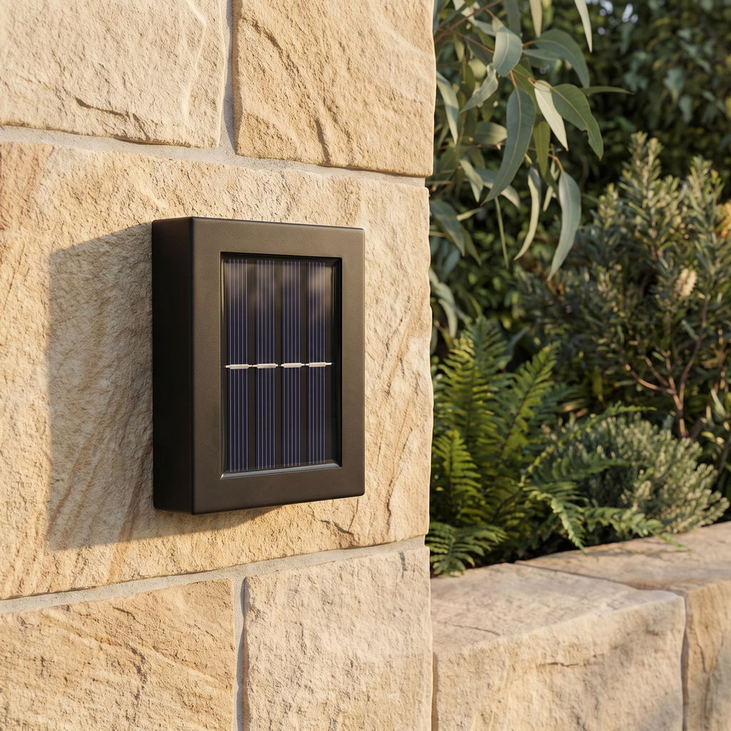 Solar Up Down Outdoor Wall Light, close view at 45 degrees on a stone wall
