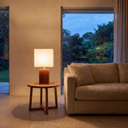 Solid Bamboo Japandi Table Lamp on a side table beside a sofa
