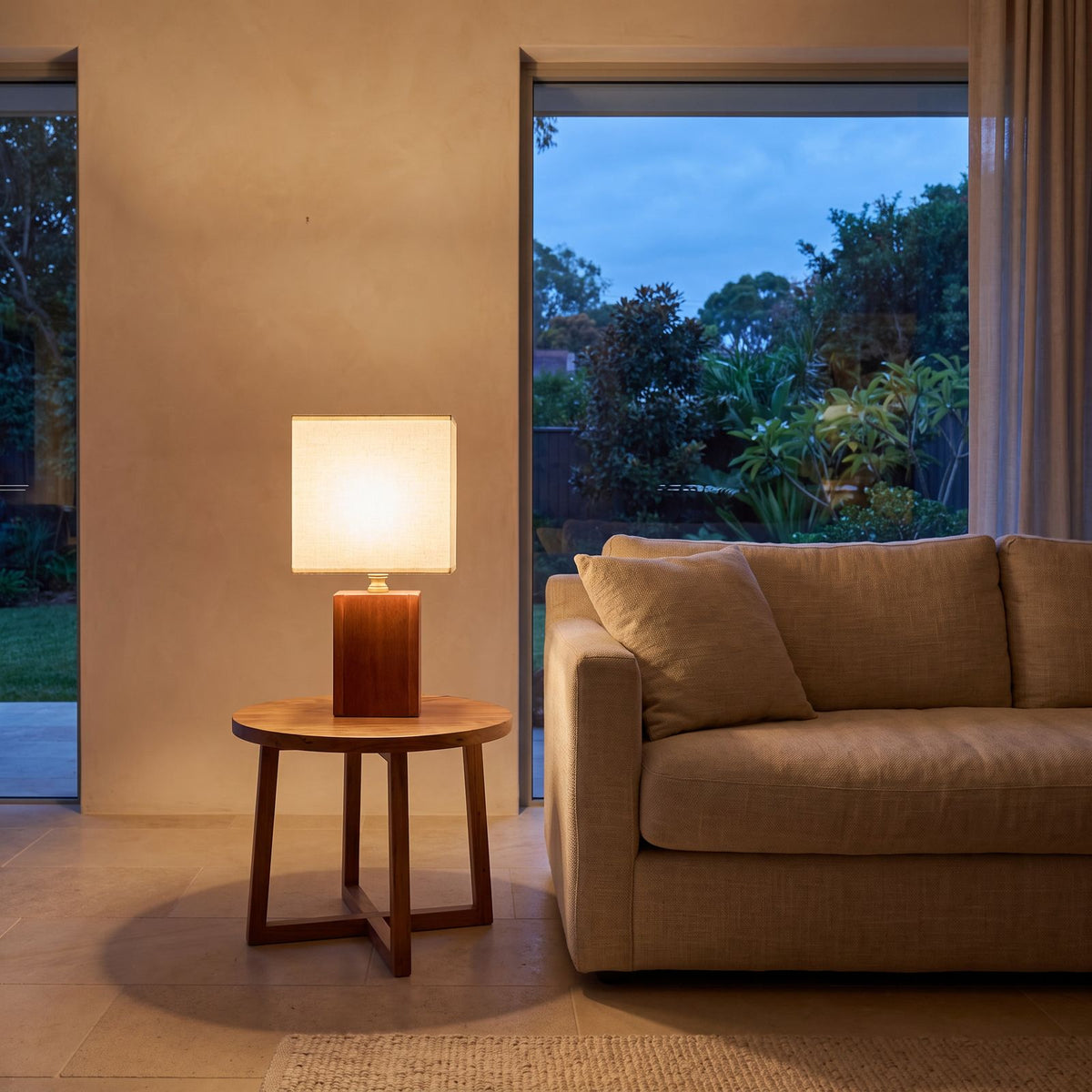 Solid Bamboo Japandi Table Lamp on a side table beside a sofa