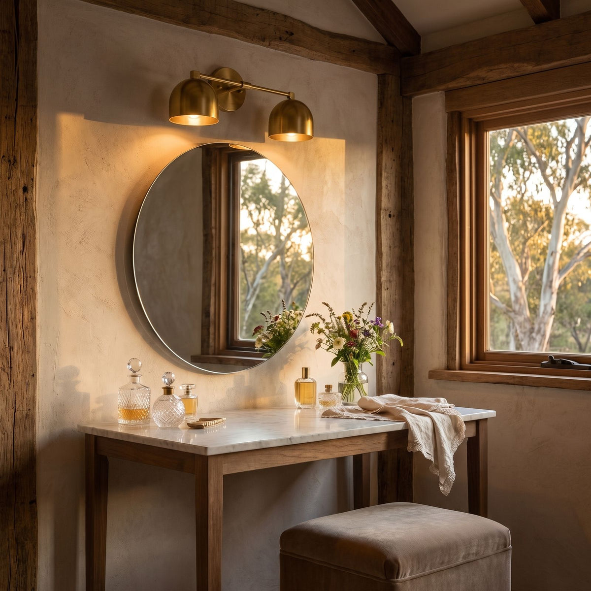 Solid Brass Double Dome Vanity Wall Light above the mirror of a dressing table