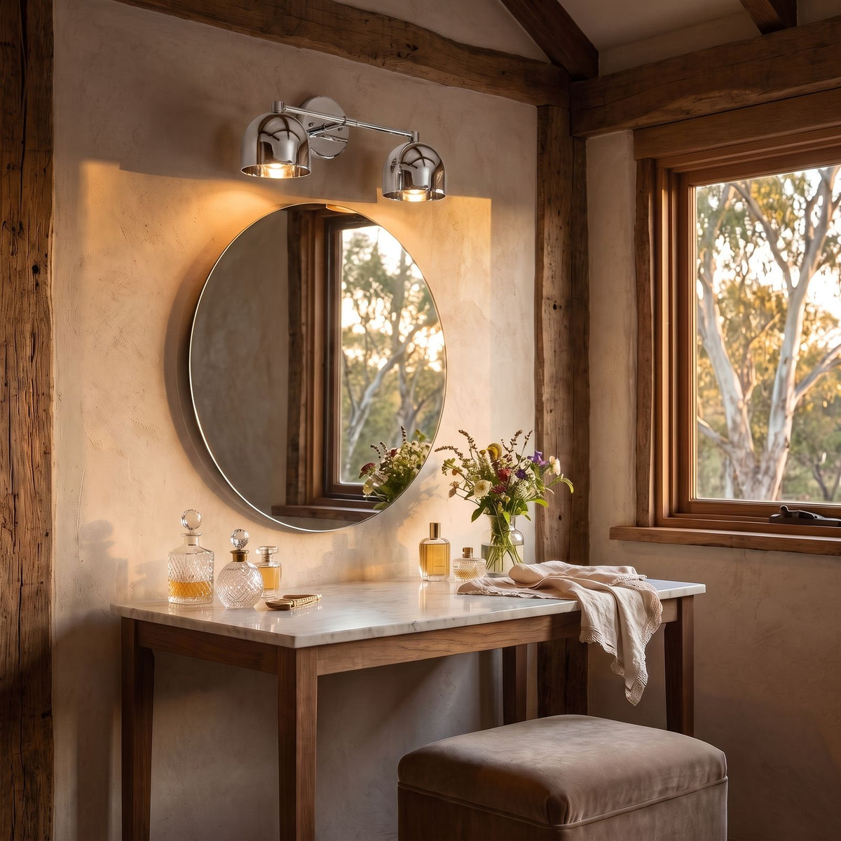 Solid Brass Double Dome Vanity Wall Light in chrome, above the mirror of a dressing table