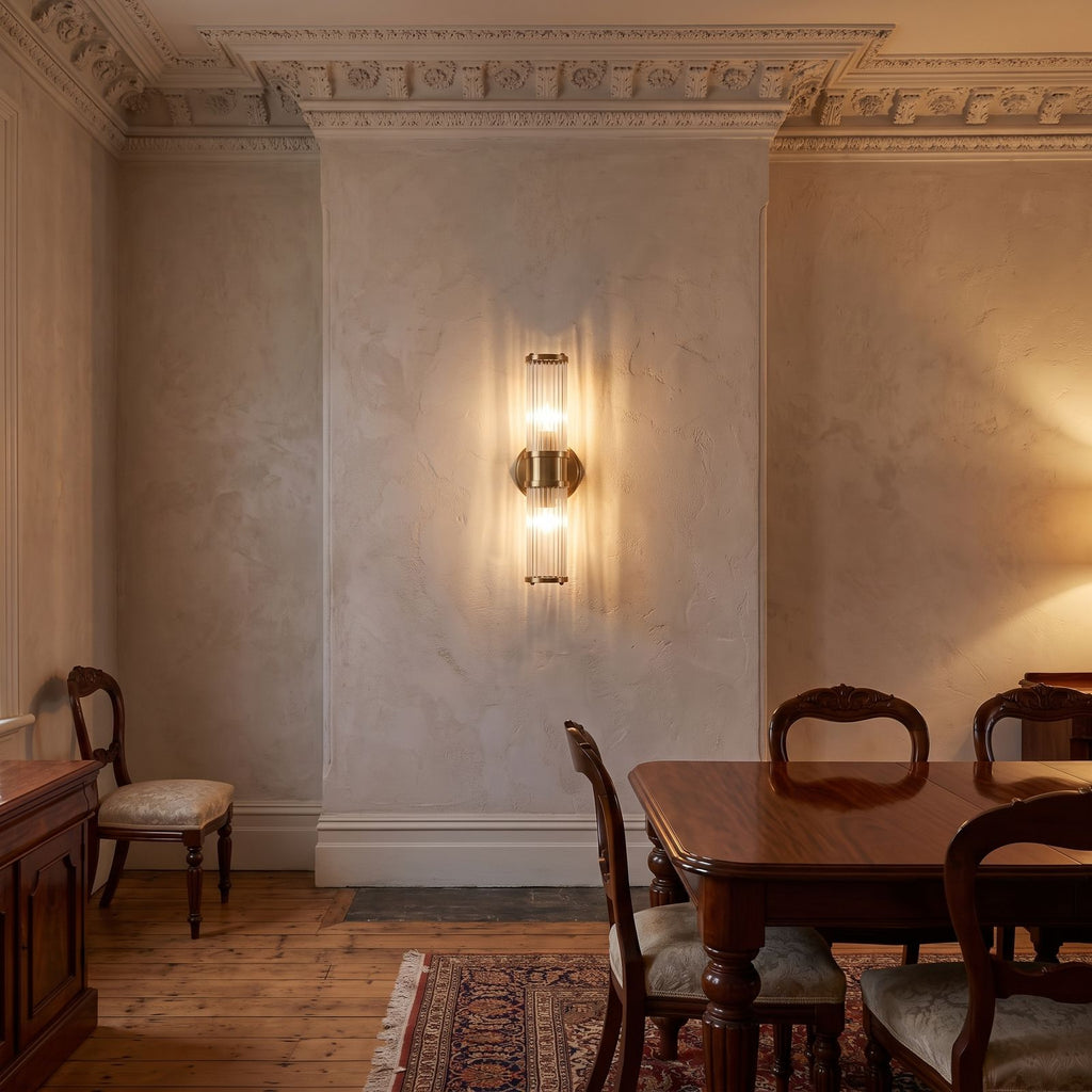 Ribbed Crystal Glass Tube Gold Wall Light with two tubes on a dining room wall