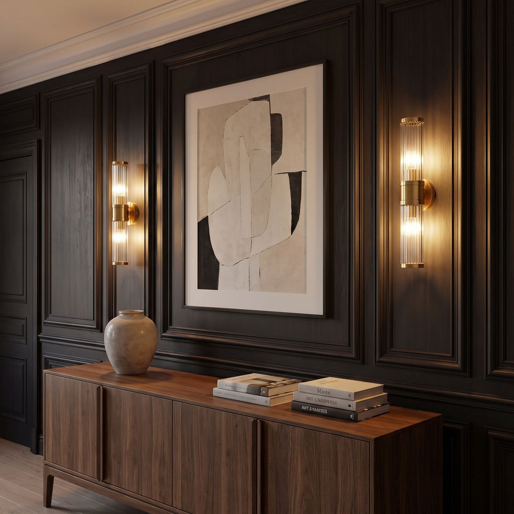 Pair of Ribbed Crystal Glass Tube Gold Wall Lights either side of an artwork above a sideboard in a classic living room