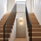 Ribbed Crystal Glass Tube Gold Wall Light with two tubes on a staircase wall in a hallway landing