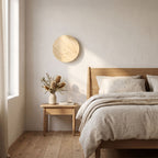 Solid Yellow Travertine Round LED Wall Light on a bedroom wall beside the bed