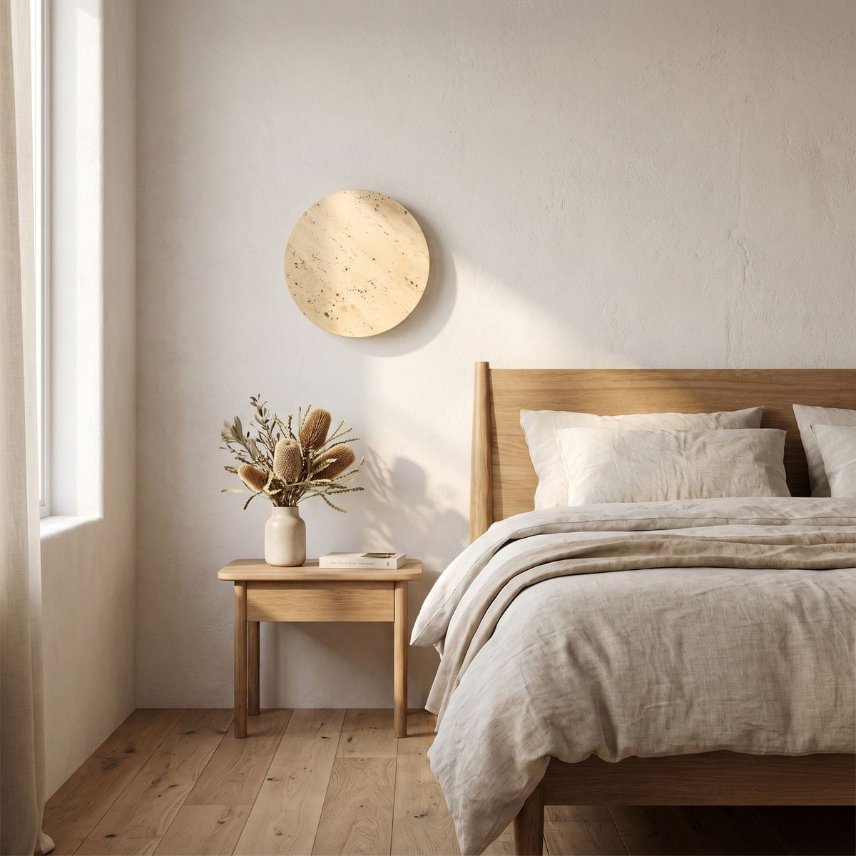 Solid Yellow Travertine Round LED Wall Light on a bedroom wall beside the bed