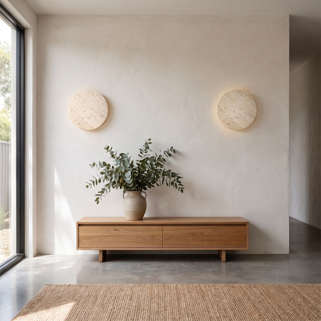Solid Yellow Travertine Round LED Wall Light in a pair on a wall of an Australian home