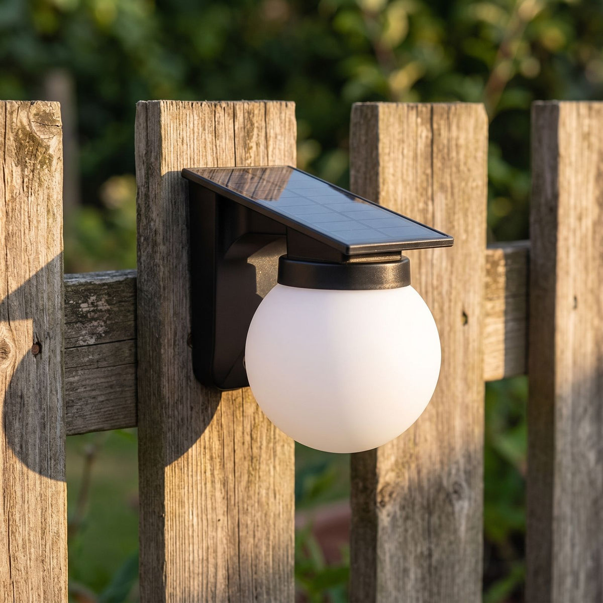 Spherical Solar Outdoor Wall Light, close view at 45 degrees on a stone wall