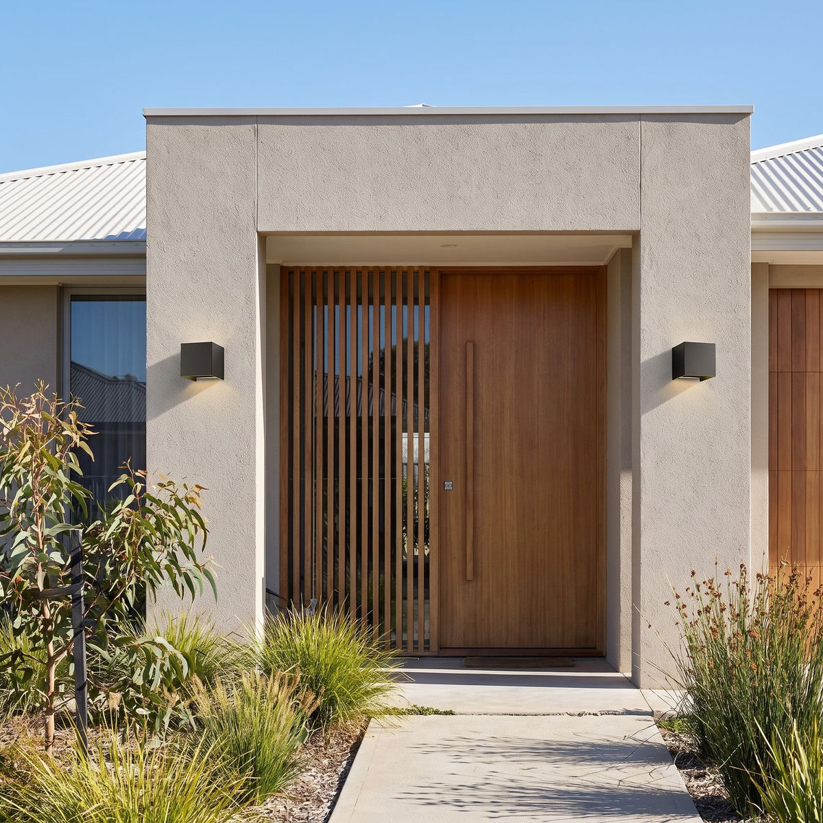 Square Adjustable Beam LED Outdoor Wall Light in a pair on the facade of an Australian home