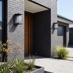 Square Frame Glass Outdoor Wall Lantern in a pair on the facade of an Australian home