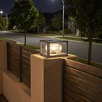 Square frame solar pillar light on a front fence pier at night