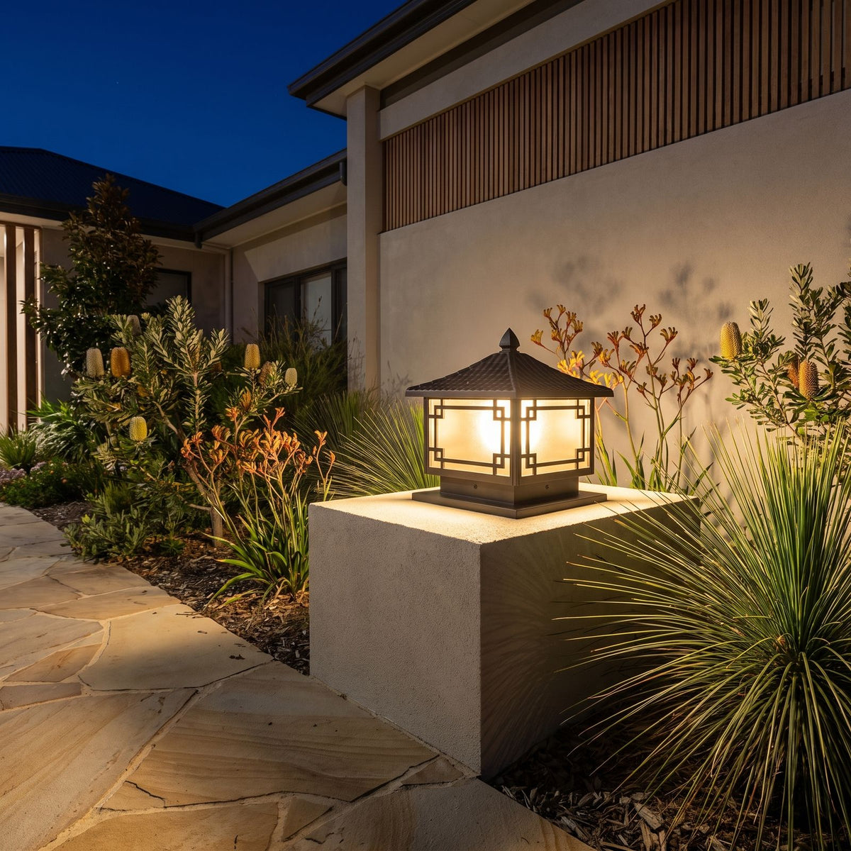 Square Lattice Frame Frosted Glass Pillar Light on a garden wall pillar at night