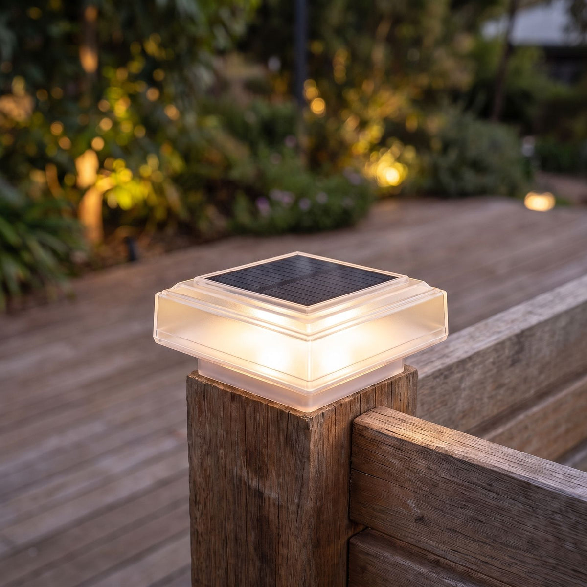Square solar post cap light on a deck balustrade post