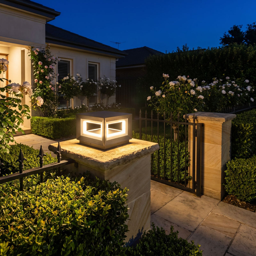 Square Stainless Steel Window Frame LED Post Light on a garden wall pillar at night