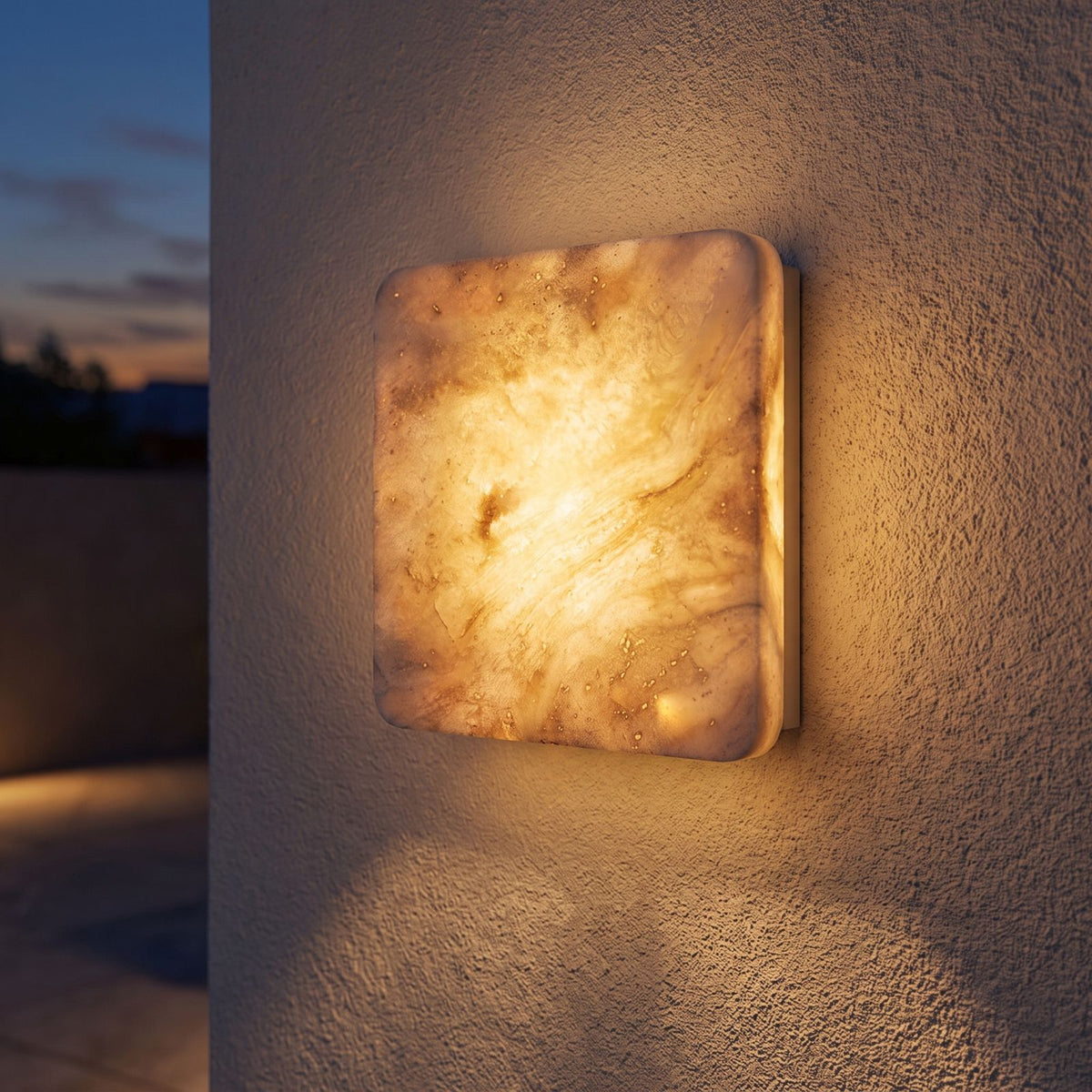 Square Travertine Stone LED Outdoor Wall Light on a porch wall at dusk
