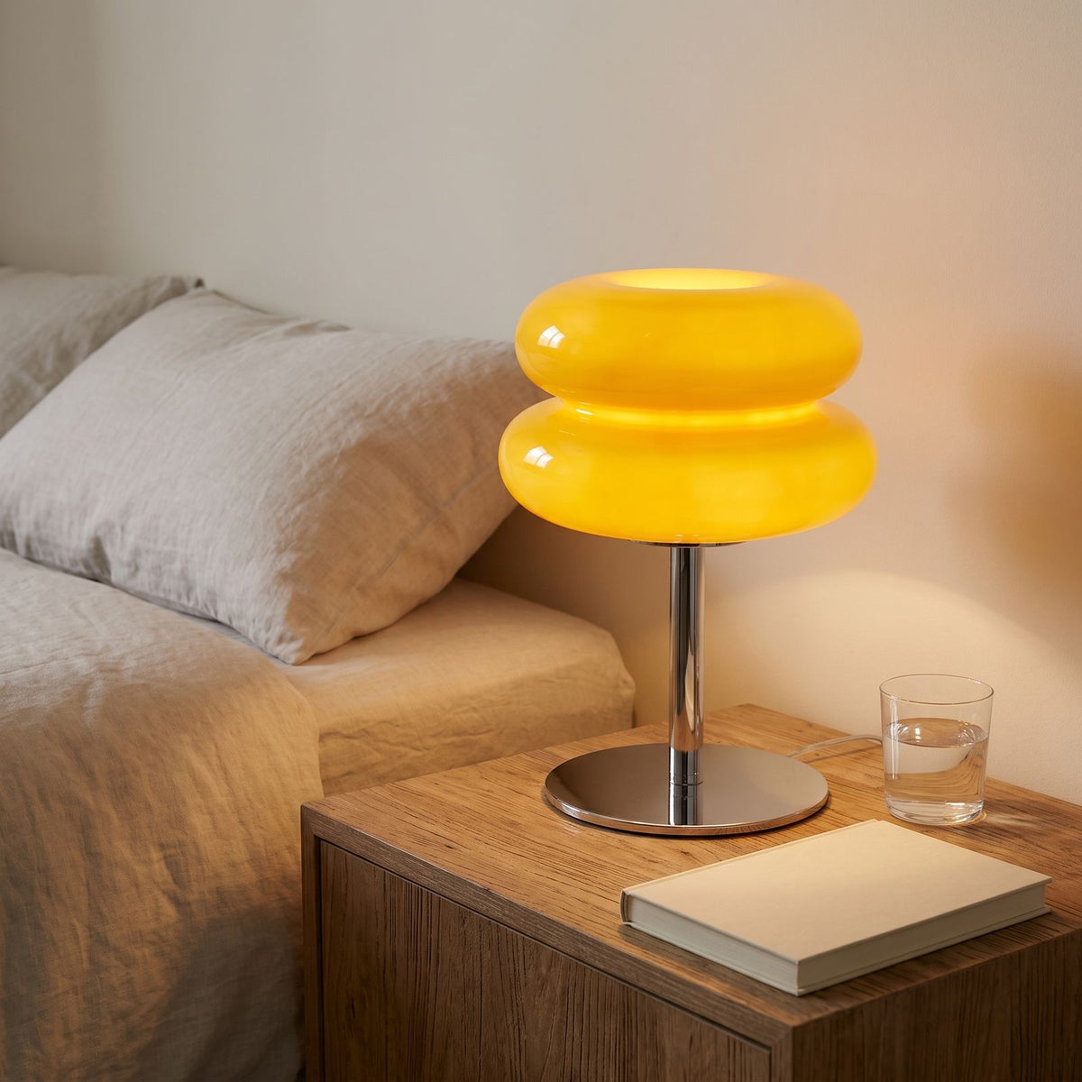 Stacked Bubble Acrylic Table Lamp in yellow on a bedside table