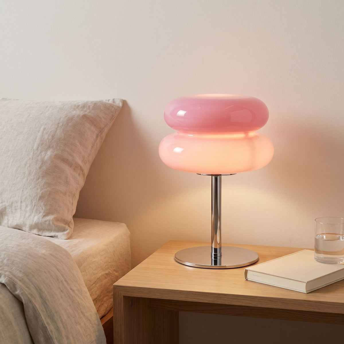 Stacked Bubble Acrylic Table Lamp in pink on a bedside table