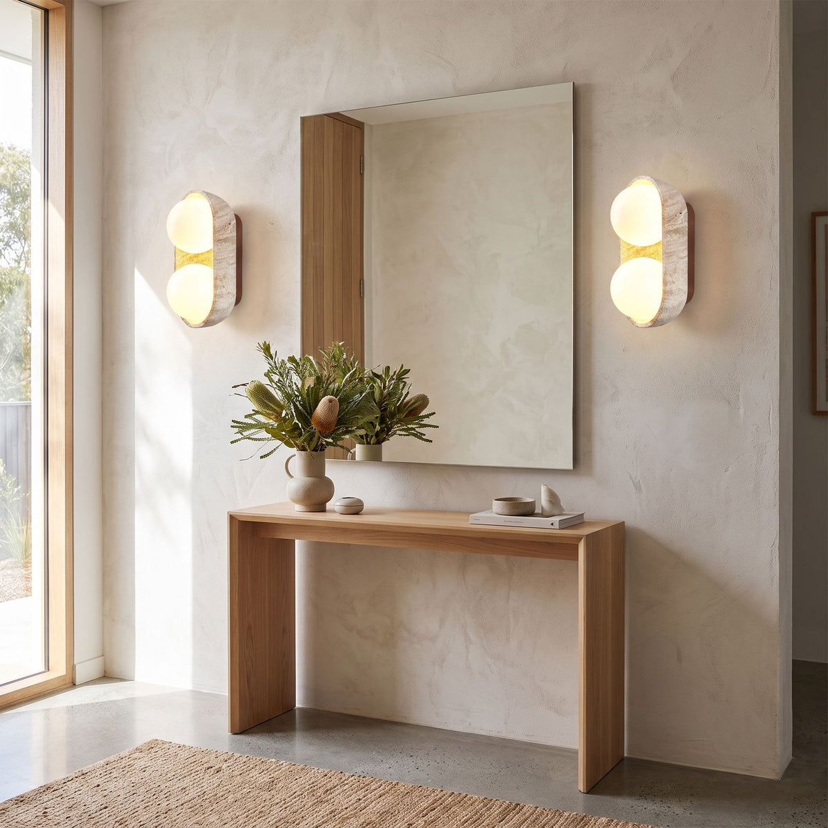 Stacked Frosted Globe Travertine Wall Light in a pair on a wall of an Australian home