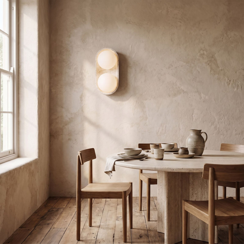 Stacked Frosted Globe Travertine Wall Light on a dining room wall