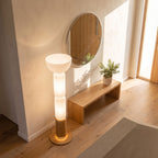 Stacked glass capsule floor lamp in an entry hall in daylight