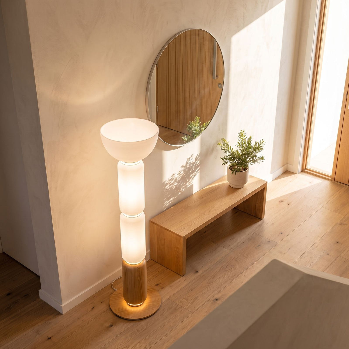 Stacked glass capsule floor lamp in an entry hall in daylight