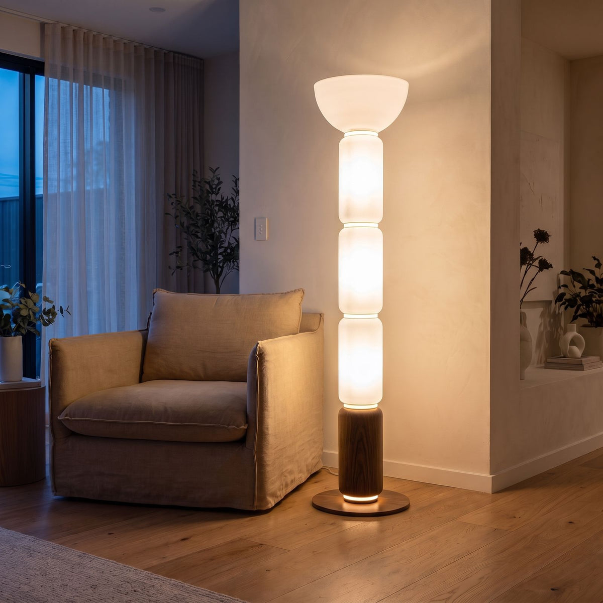 Stacked Glass Capsule Bowl Shade LED Floor Lamp in the 150 cm size beside an armchair