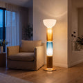 Stacked Glass Capsule Bowl Shade LED Floor Lamp with blue and amber glass beside an armchair