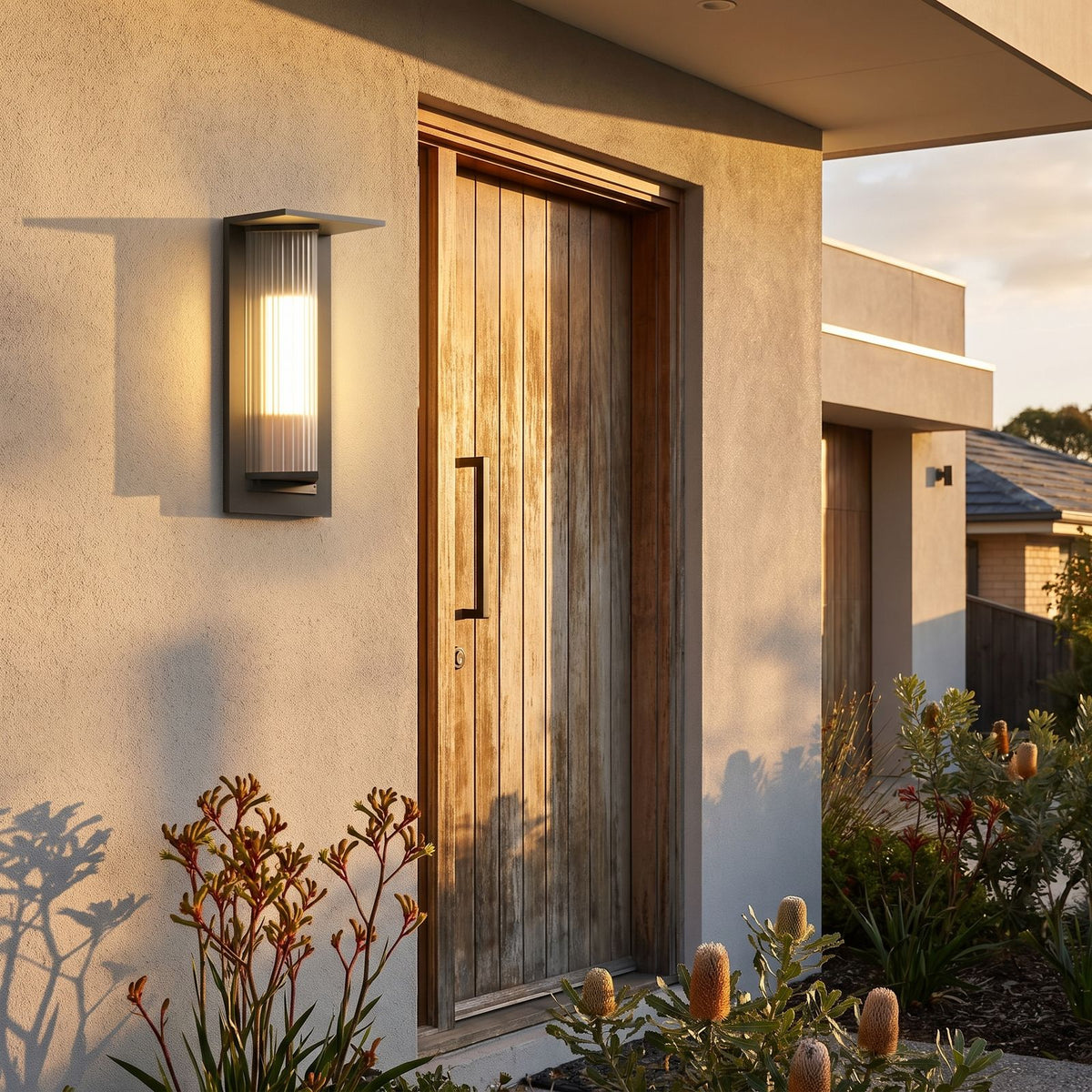 Striped Acrylic Cylinder Outdoor Wall Light beside a timber front door