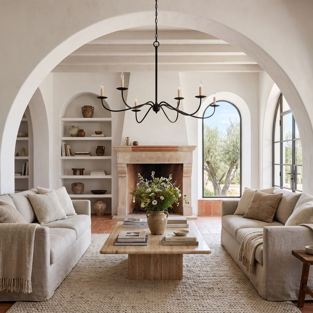 Sweeping Curved Arm Six Light Chandelier above a coffee table in a living room in daylight
