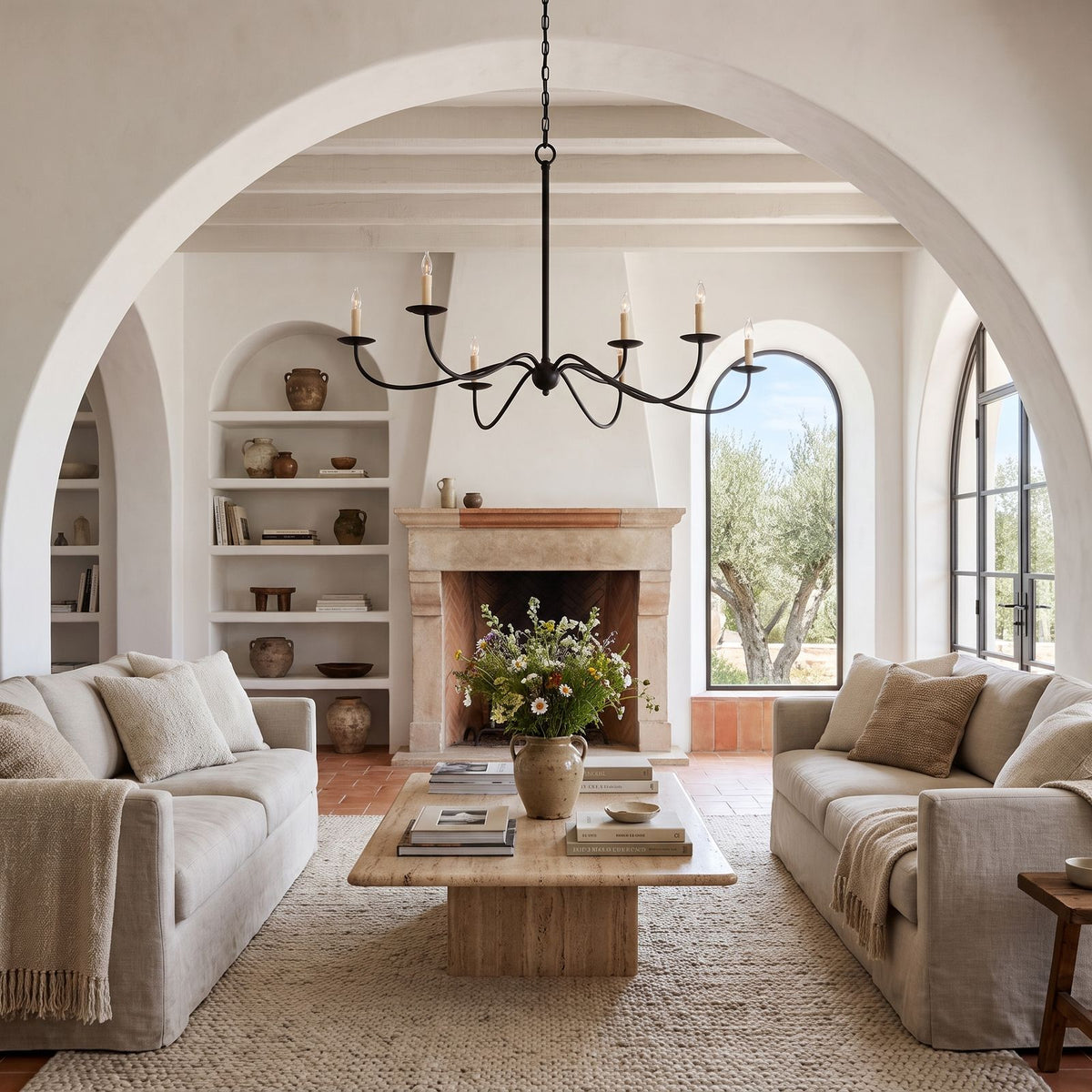 Sweeping Curved Arm Six Light Chandelier above a coffee table in a living room in daylight