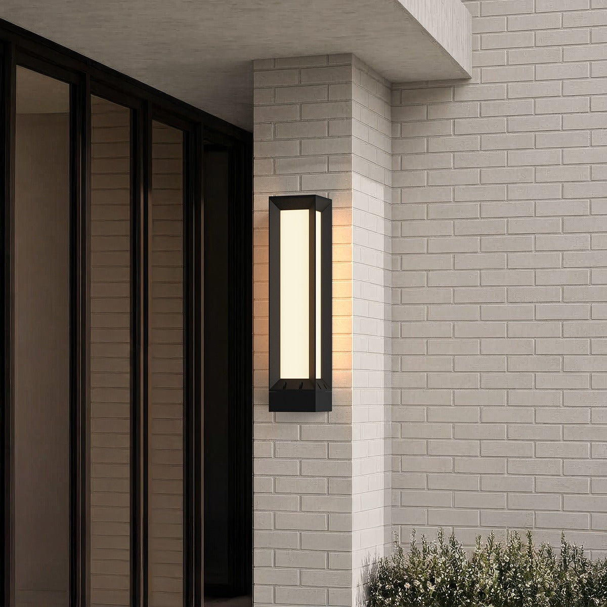 Tall frosted LED outdoor wall light beside a glass door