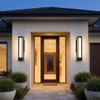A pair of Tall Black Frame LED Outdoor Wall Lights framing a double entry door