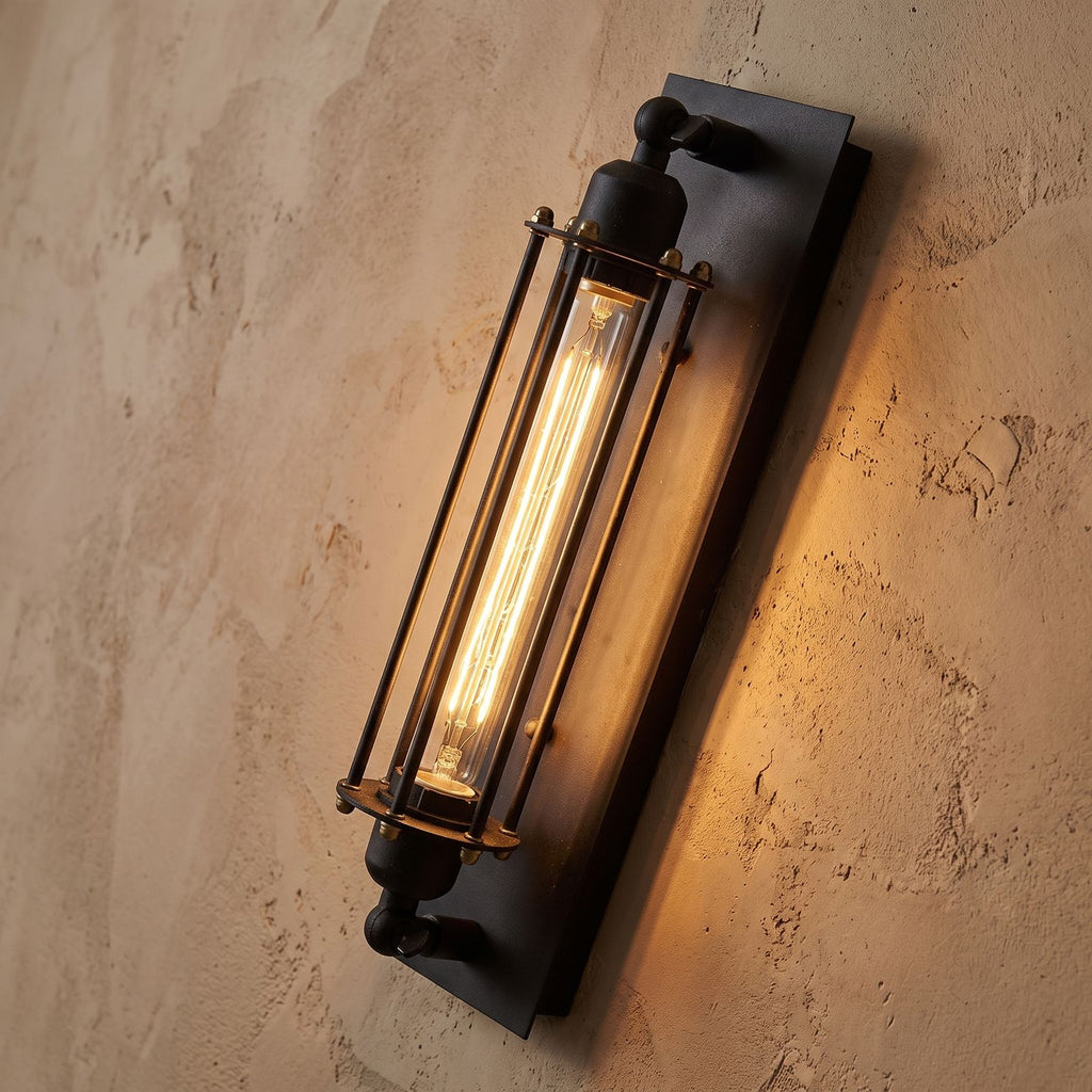 Tall Black Iron Flute Edison Wall Light, close view at 45 degrees on a plaster wall