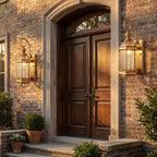 Tall Brass and Clear Glass Outdoor Wall Lantern in a pair on the facade of an Australian home
