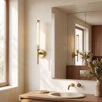 Tall Brass and Textured Glass Wall Sconce on a bedroom wall beside the bed