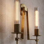 Tall Ribbed Glass and Brass Column Wall Light, close view at 45 degrees on a plaster wall