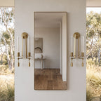 Tall Ribbed Glass and Brass Column Wall Light in a pair on a wall of an Australian home