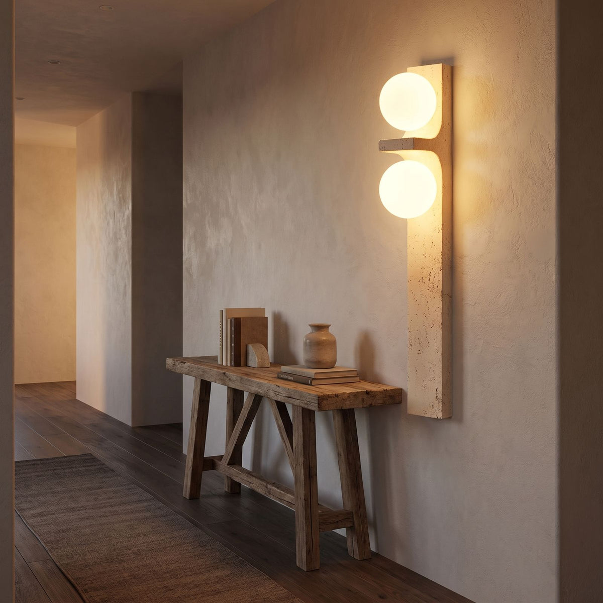 Tall Slim Travertine Strip Wall Light in a hallway above a timber console