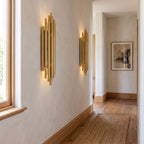 Tall Stainless Steel Up and Down Wall Light in a pair on a wall of an Australian home