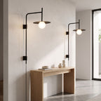 Tall Swing Arm Globe Plug-In Wall Light in a pair on a wall of an Australian home