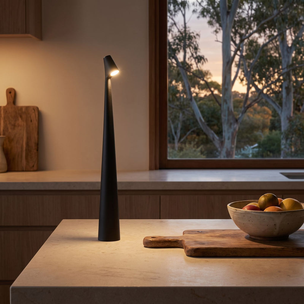 Tall tapered rechargeable table lamp on a stone kitchen bench