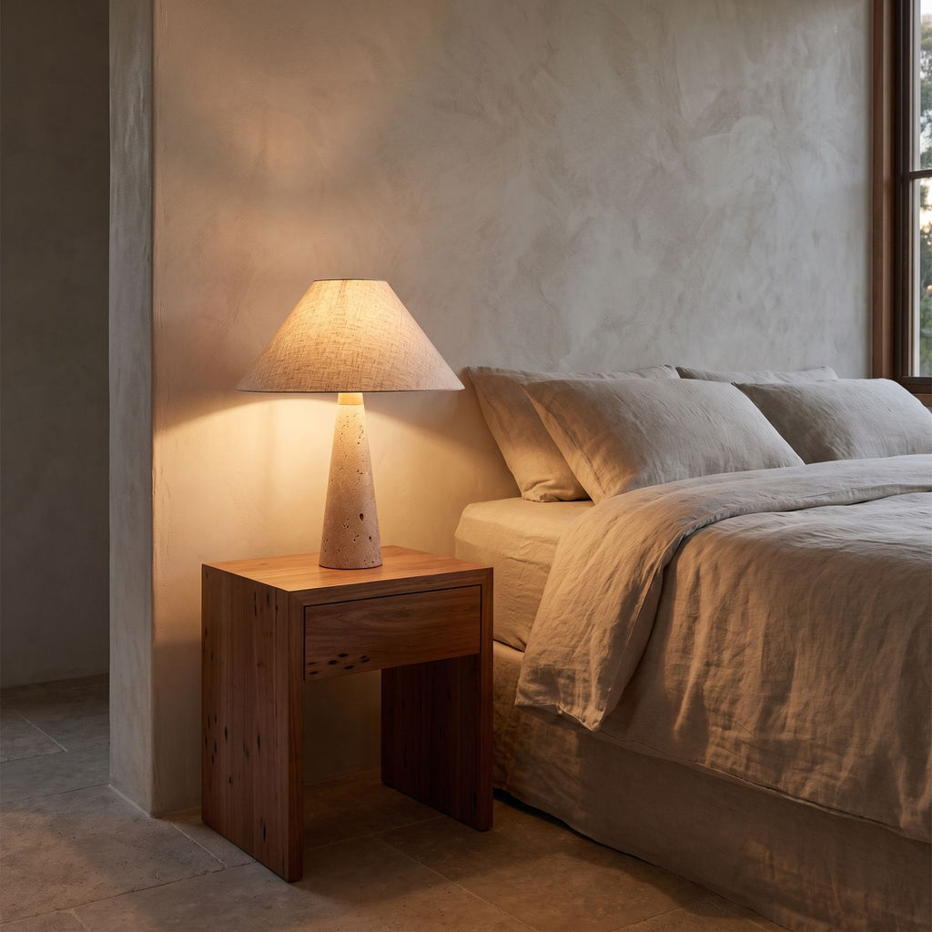Tapered Travertine Stem Table Lamp on a bedside table