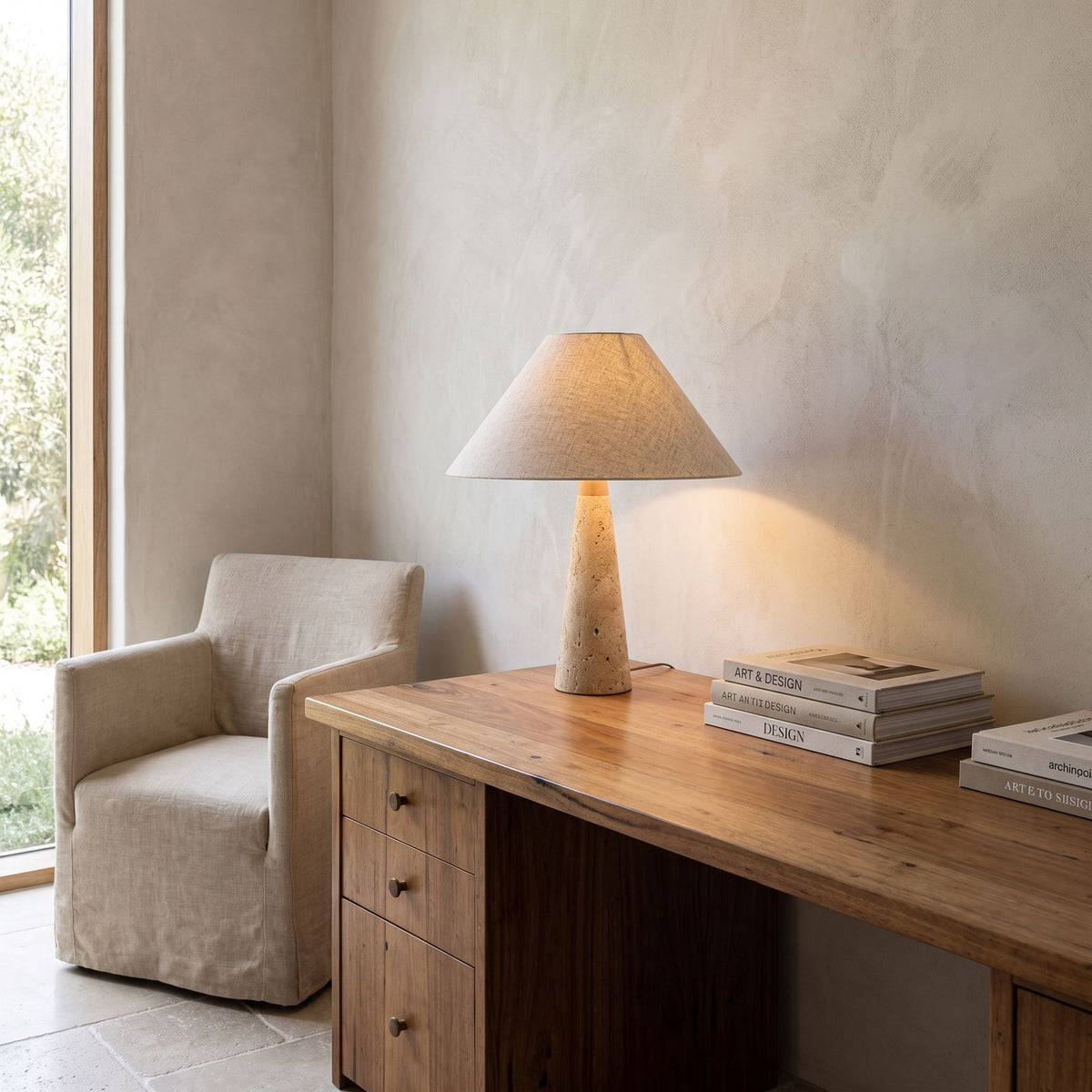 Tapered Travertine Stem Table Lamp on a study desk