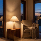 Tapered Travertine Stem Table Lamp beside a reading armchair